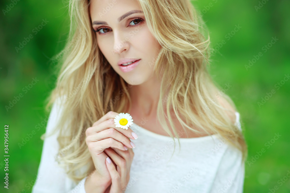 Beautiful woman with a flower. Girl with camomiles. Beautiful woman portrait. Beautiful woman with a flower. Girl with camomiles. Beautiful woman portrait.