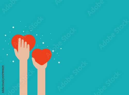 Hands holding red hearts on blue background. worldwide on-line help and support concept.