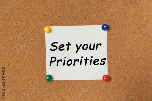 Text Set your Priorities written on a sticker