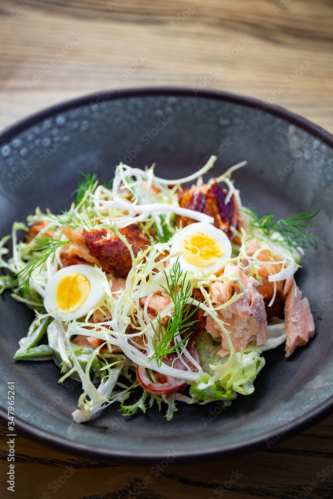 Smoked pork salad with fresh green leaves, eggs Smoked pork salad with fresh green leaves, eggs