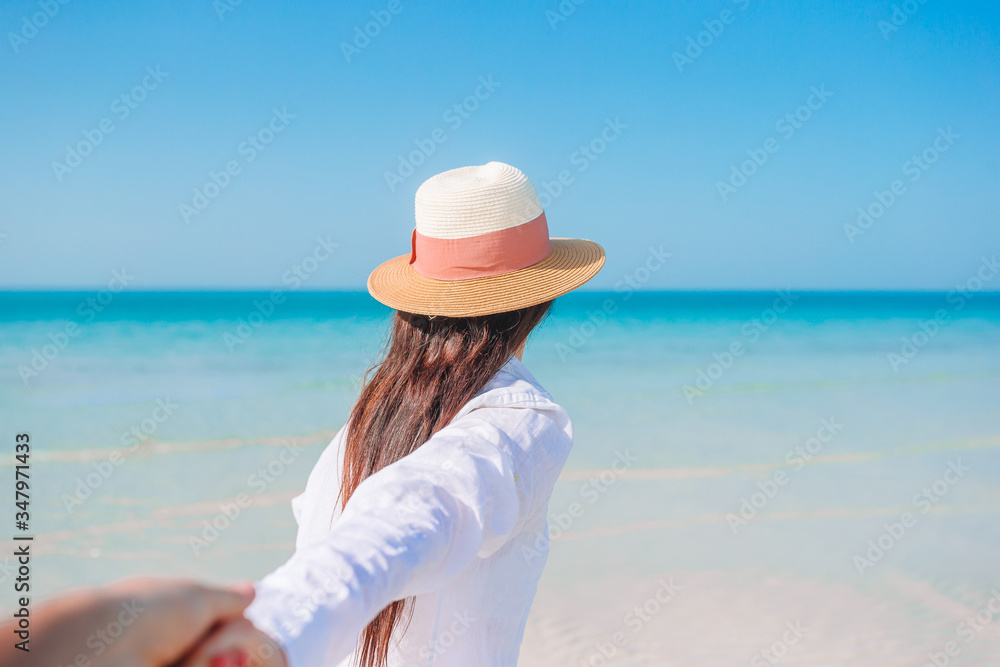 Woman laying on the beach enjoying summer holidays