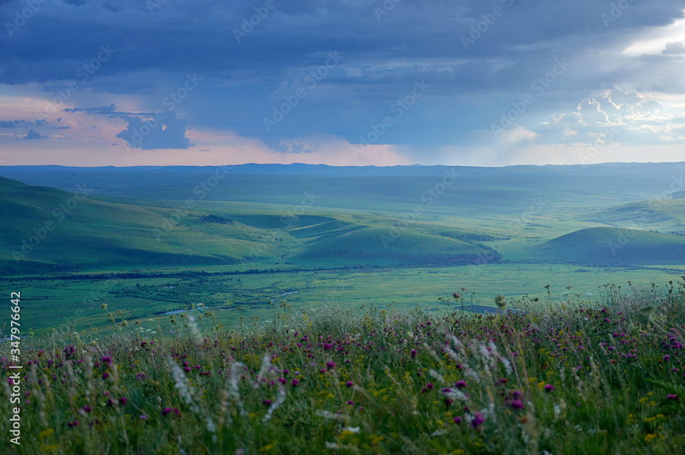 Steppes and distant green hills in the rain. Zabaykalsky Krai. Russia. Steppes and distant green hills in the rain. Zabaykalsky Krai. Russia.