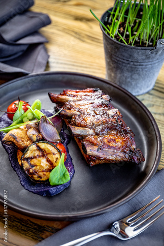 Grilled ribs with bbq sauce, purple potato purée