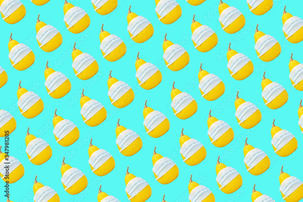 Fruit pattern of pears isolated on a blue or mint background, top view. Fruit in medical masks. covid-19. Fruit pattern of pears isolated on a blue or mint background, top view. Fruit in medical masks. covid-19.