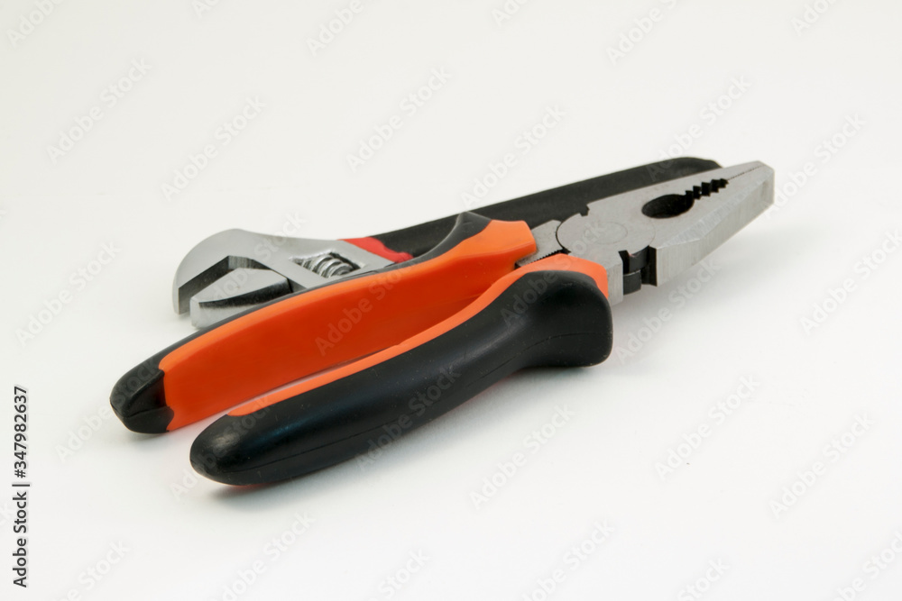 metal tools on a white background lie next to each other metal tools on a white background lie next to each other