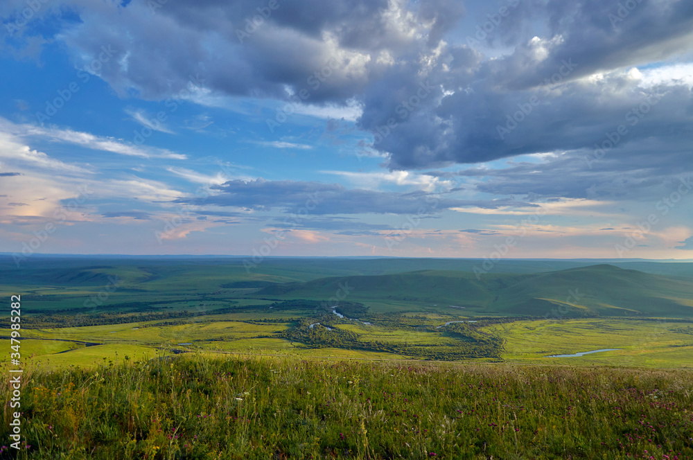 Steppes and distant green hills in the rain. Zabaykalsky Krai. Russia. Steppes and distant green hills in the rain. Zabaykalsky Krai. Russia.