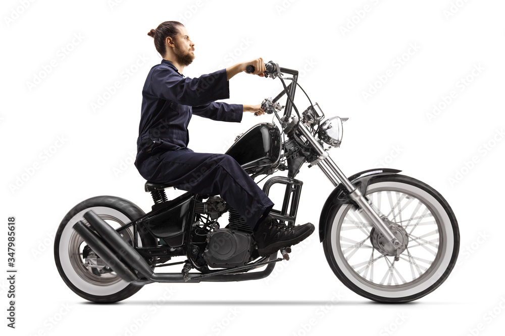 Mechanic riding a chopper motorbike