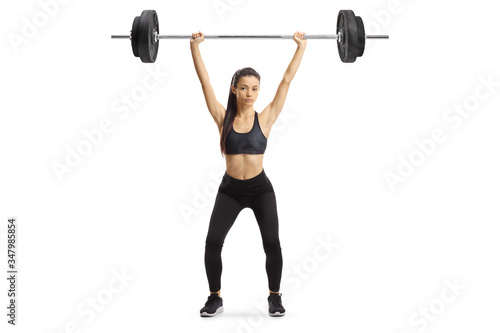 Young woman exercising weight lifting