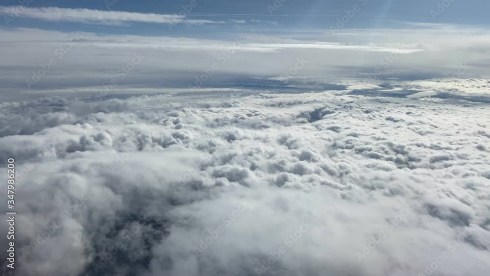 Beautiful clouds and blue sky - view from the airplane window Beautiful clouds and blue sky - view from the airplane window