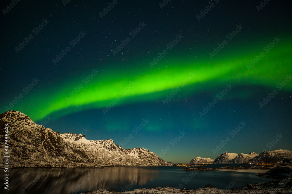 Nature of Norway, amazing northern lights, aurora borealis over the mountains in the North of Europe - Lofoten islands, Norway