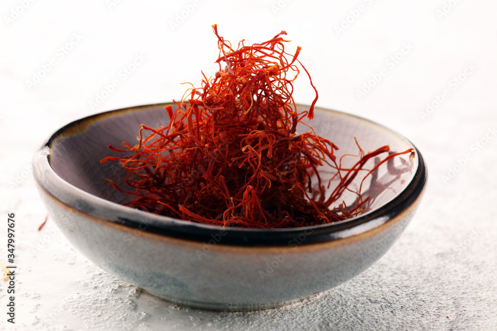 Fototapeta premium Kesar, Saffron, Crocus Sativus on rustic table, Pile of indian Saffron