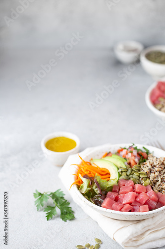 Healthy raw tuna bowl with quinoa and vegetales. Buddha bowl © lblinova