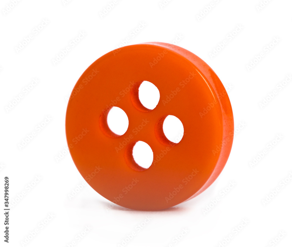 Fototapeta premium Orange button on a white background.