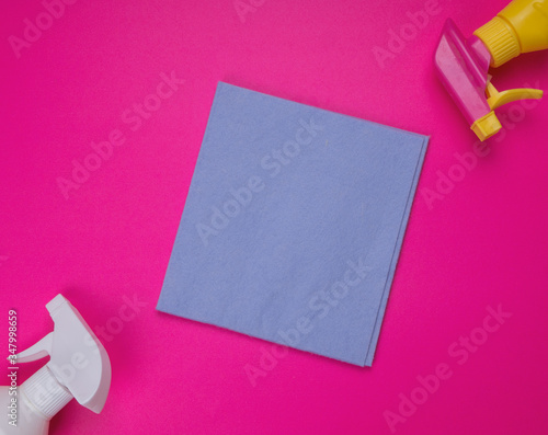 Detergents and cleaning accessories in pink color. Cleaning service, small business idea. Flat lay, Top view. Commercial cleaning company concept. disinfection product. Sanitizer. sponge, spray. rag