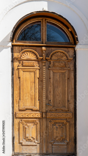 Ancient Gothic Church Portal Carved Wooden Door Church. Large Brown Antique Style Doors Full Frame. Historic Entrance of a Church