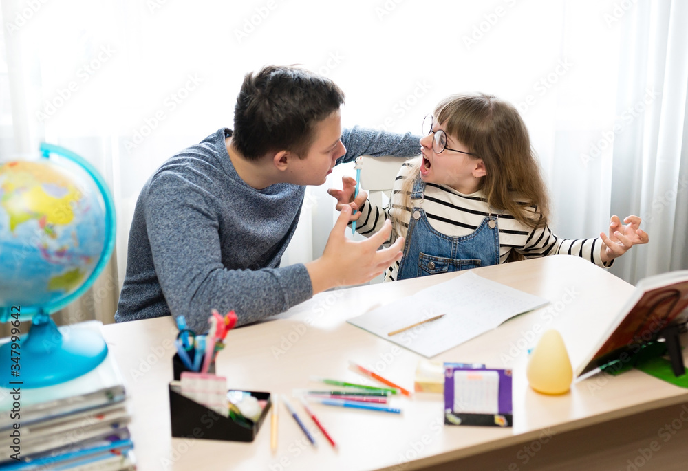Stress of the child during home lessons. Nerves, emotions, children screaming at each other. Home lessons, distance education, quarantine Stress of the child during home lessons. Nerves, emotions, children screaming at each other. Home lessons, distance education, quarantine
