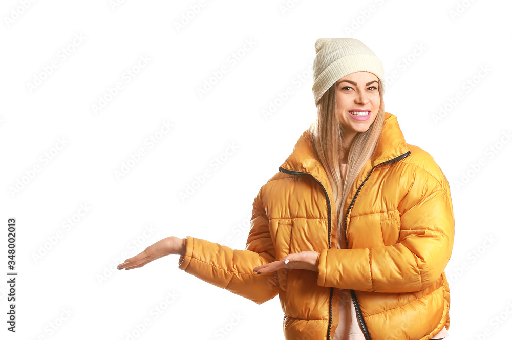 Portrait of beautiful young woman showing something on white background Portrait of beautiful young woman showing something on white background