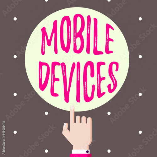 Conceptual hand writing showing Mobile Devices. Concept meaning A portable computing device like smartphone tablet computer Hand Pointing up Index finger Touching Solid Color Circle photo