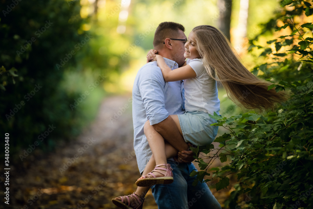 Fototapeta premium Happy daughter with her father in the park