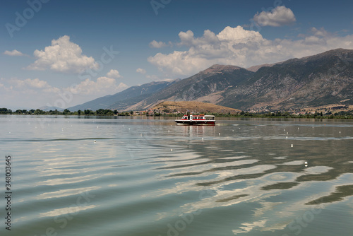 View of the lake Pamvotis in the city of Ioannina and swimming ship