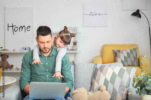Working father with naughty...