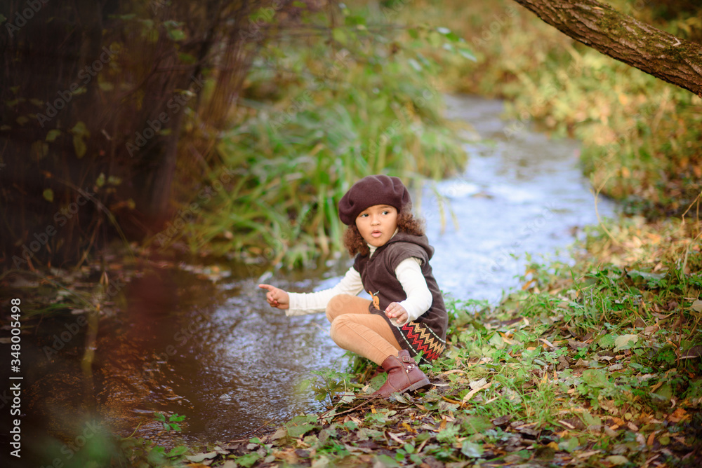 Happy Little Girl playing in the river. Happy Little Girl playing in the river.