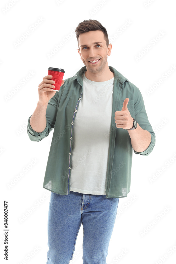 Handsome man with coffee showing thumb-up on white background Handsome man with coffee showing thumb-up on white background
