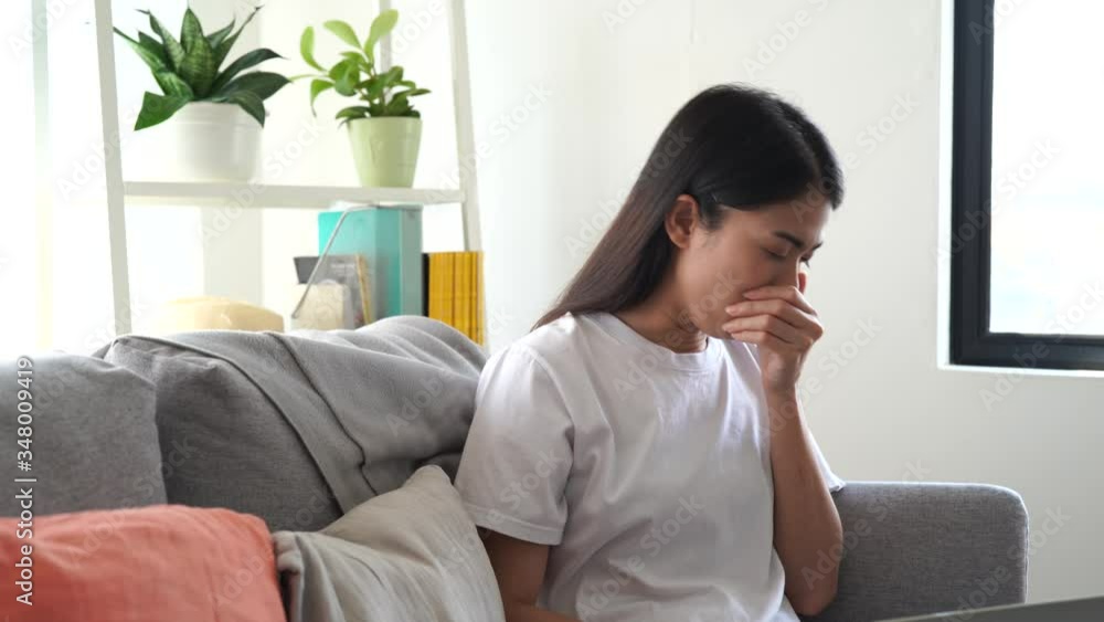 Asian woman have a cough and sore throat. Asian woman have a cough and sore throat.