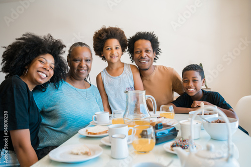 Family having breakfast together at home.