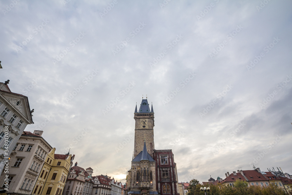 Naklejka premium Panorama of Old Town Square (Staromestske Namesti) with a focus on the clock tower of Old Town Hall, a major landmark of Prague, Czech Republic, also called staromestska radnice