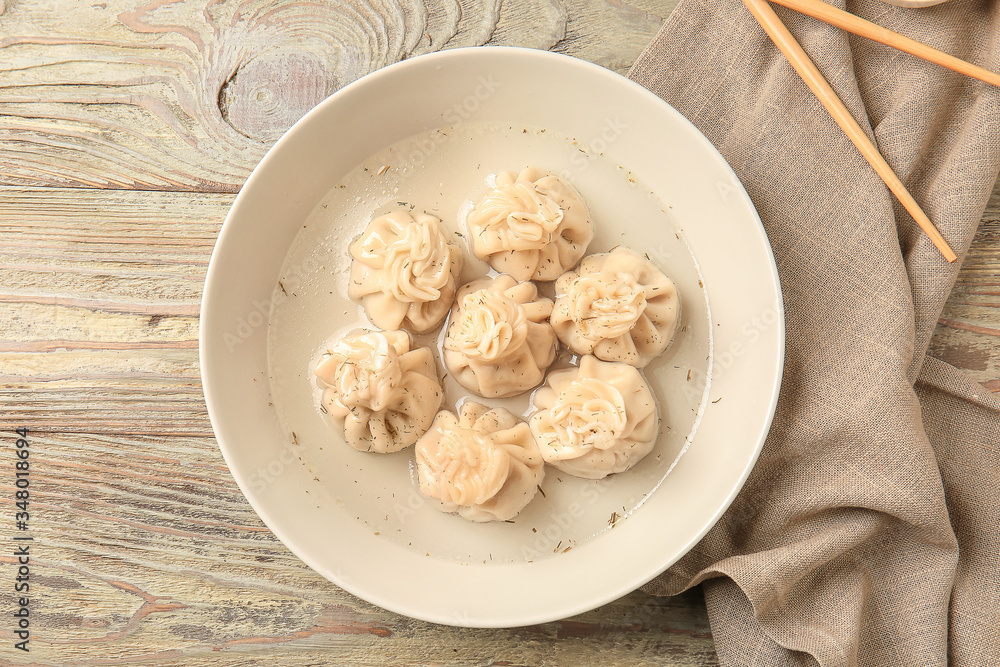 Plate with tasty dumplings on table Plate with tasty dumplings on table