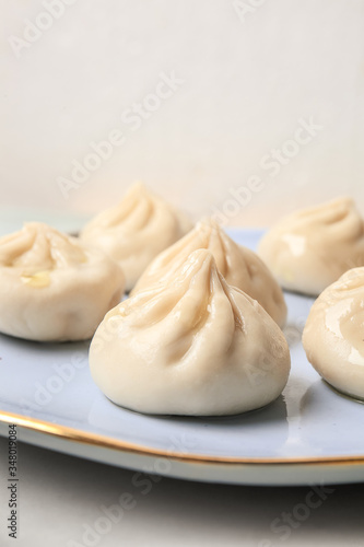 Plate with tasty dumplings, closeup