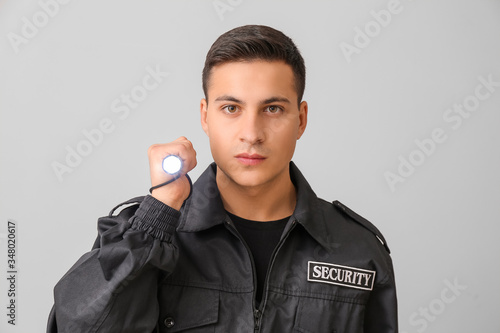 Male security guard with fl...