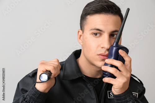 Male security guard with fl...