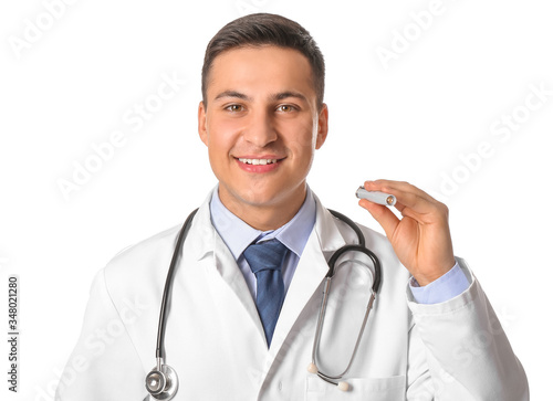 Male doctor with flashlight...