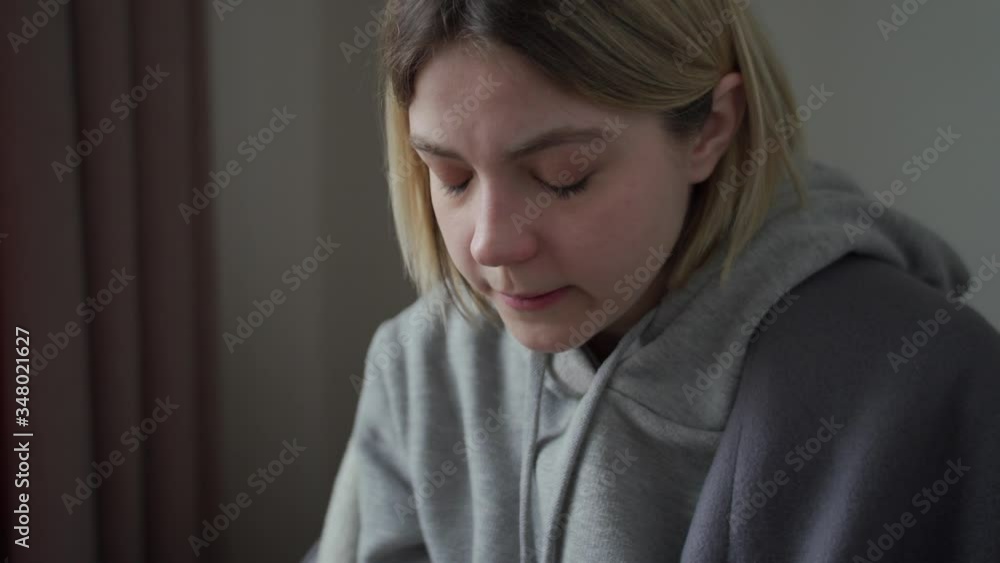 The quarantined girl is treated with hot tasty tea with lemon. Getting natural vitamin. Treatment for acute respiratory infections, colds, bronchitis The quarantined girl is treated with hot tasty tea with lemon. Getting natural vitamin. Treatment for acute respiratory infections, colds, bronchitis