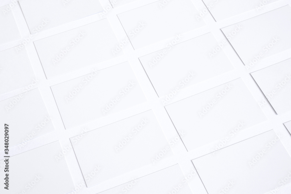 Blank business cards in checkerboard order isolated on white Blank business cards in checkerboard order isolated on white