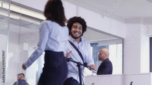 Casual middle eastern business man arriving and leaving from his office on his bicycle
