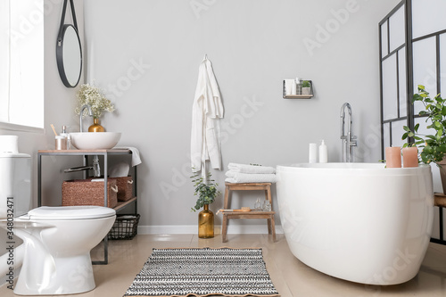 Interior of bathroom with floral decor