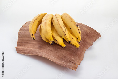 background; banana; closeup; diet; food; fresh; healthy; macro; ripe; tropical; yellow; white; snack; coconut leaf basket; sweet; organic; banan; isolated; coward; target; candid; scene background; fr photo