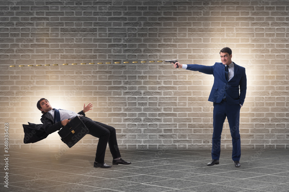 Businessman with gun threatening his competitor Businessman with gun threatening his competitor