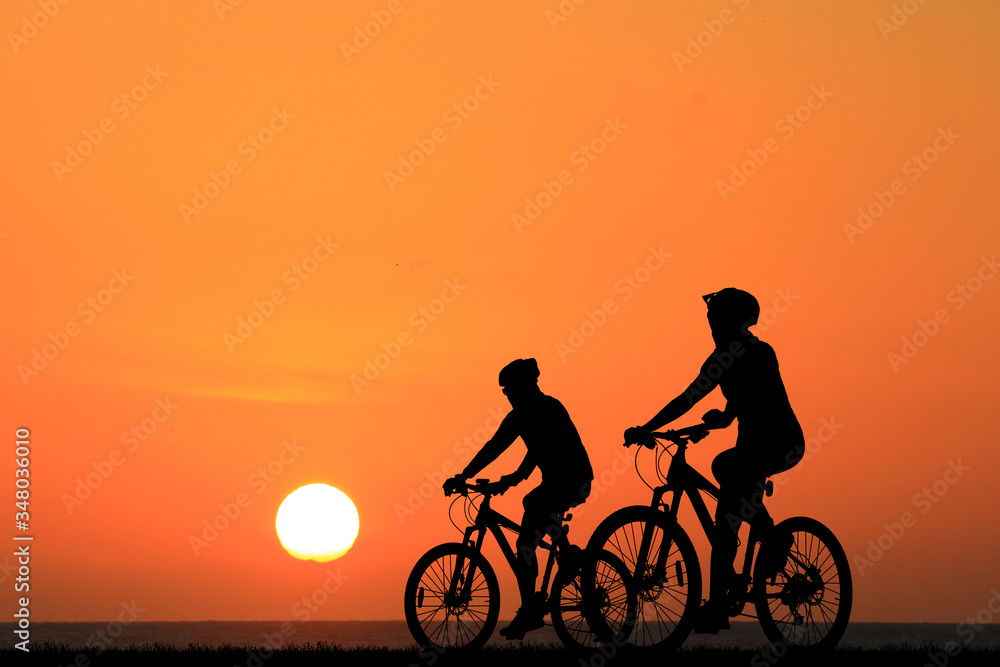 Silhouette Cycling on blurry sunrise sky background. Silhouette Cycling on blurry sunrise sky background.