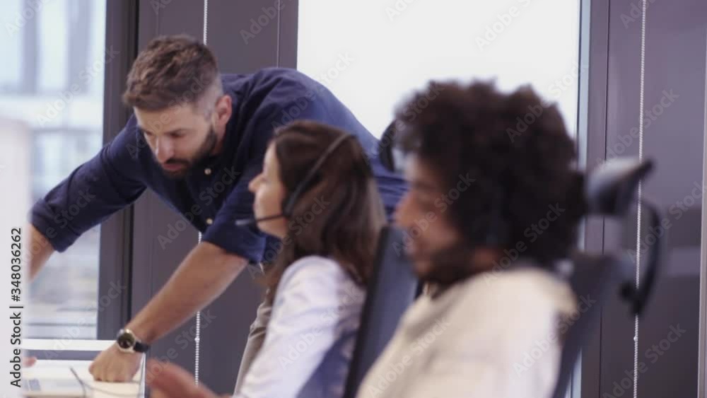 Multi ethnic group of workers working in a call center office
Multi ethnic group of workers working in a call center office