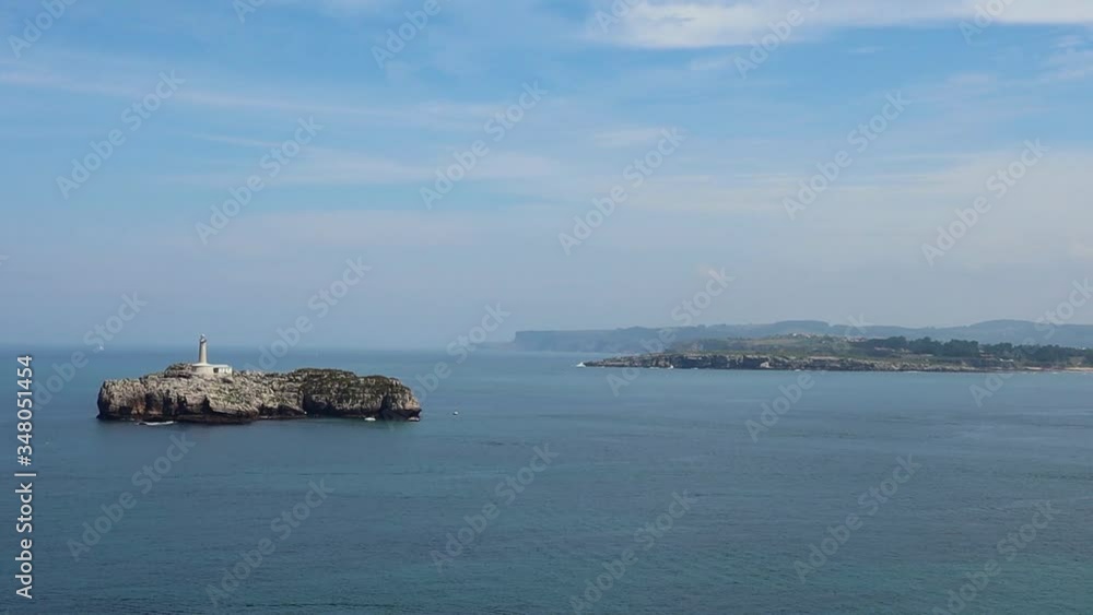 View to the Island with a Beacon in the Ocean in Parque de La Magdalena, Santander, Spain