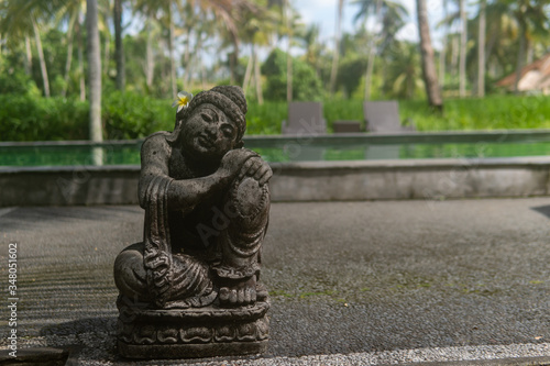 Grey Stone Statue with Flower in Ear