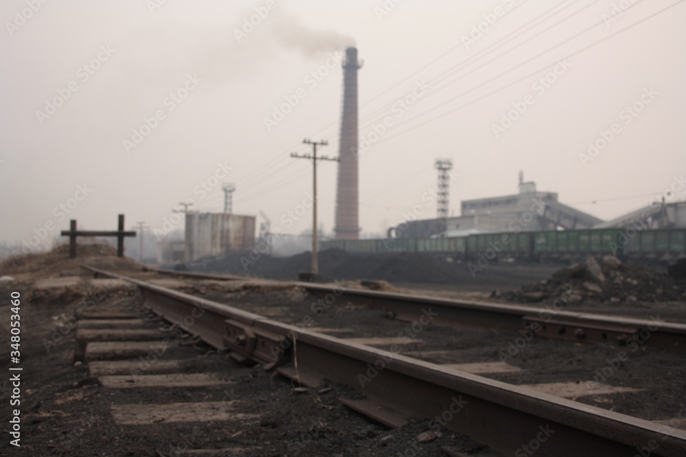 industrial landscape with steam locomotive