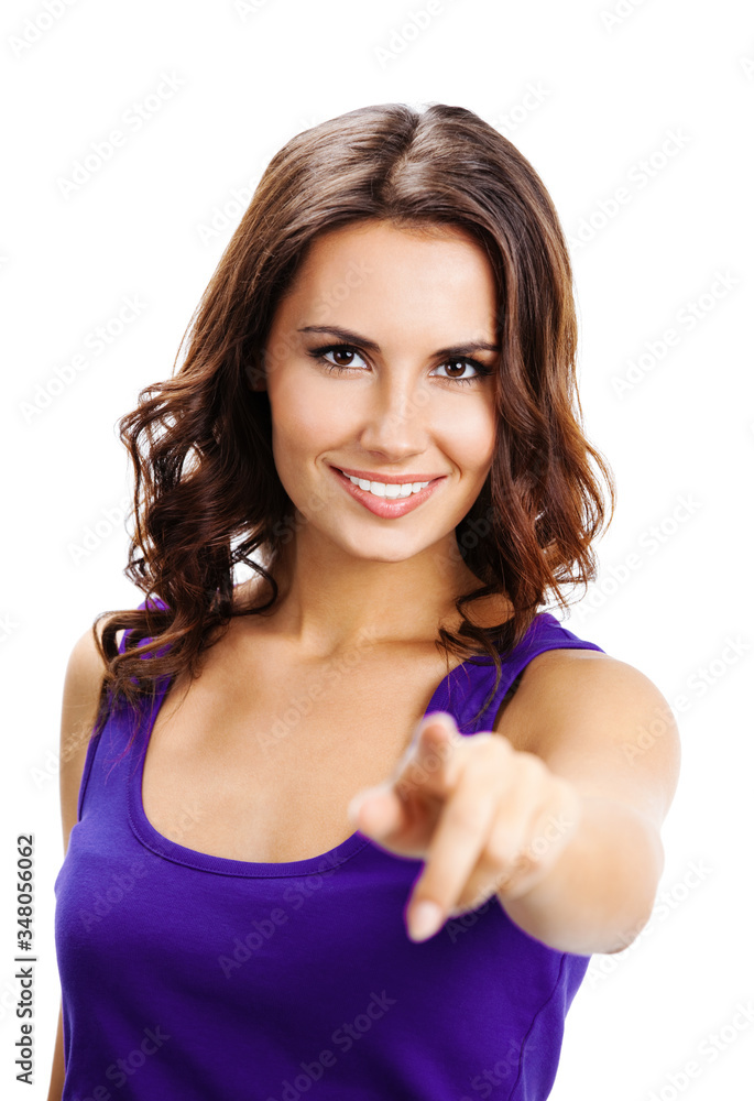 Portrait of happy smiling beautiful young woman in violet casual smart clothing, pointing at you, or pressing virual button, isolated over white background Portrait of happy smiling beautiful young woman in violet casual smart clothing, pointing at you, or pressing virual button, isolated over white background