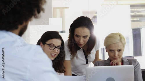Multi ethnic group of workers working in a call center office
