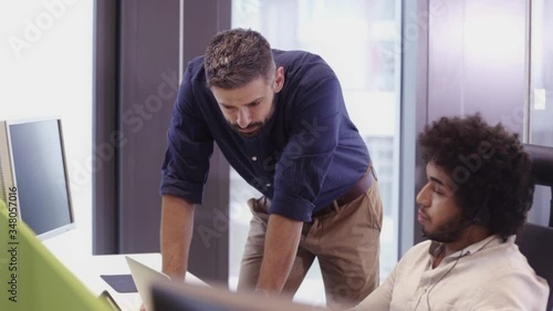 Multi ethnic group of workers working in a call center office
