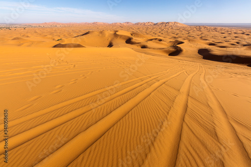 Desert Sahara with beautiful lines and colors at sunrise. Merzouga  Morocco